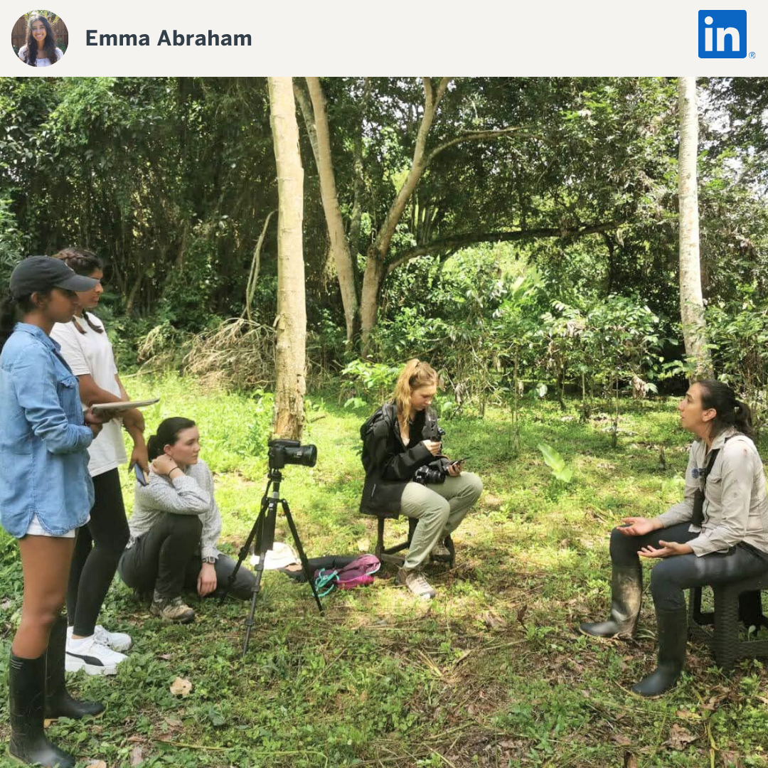 Students conducting field interview in a forested area